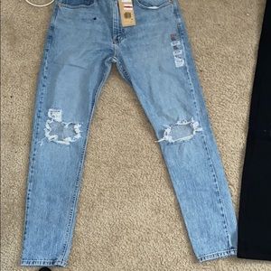 2 pair of black and denim ripped jeans never worn